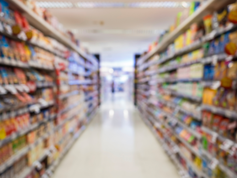 Supermarket shelf Blurred Interior perspective as background