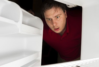 Man Looking in Refrigerator | Queens Frigidaire Refrigerator Repair