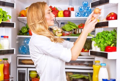 Woman Organizing Refrigerator | Speedy Refrigerator Service